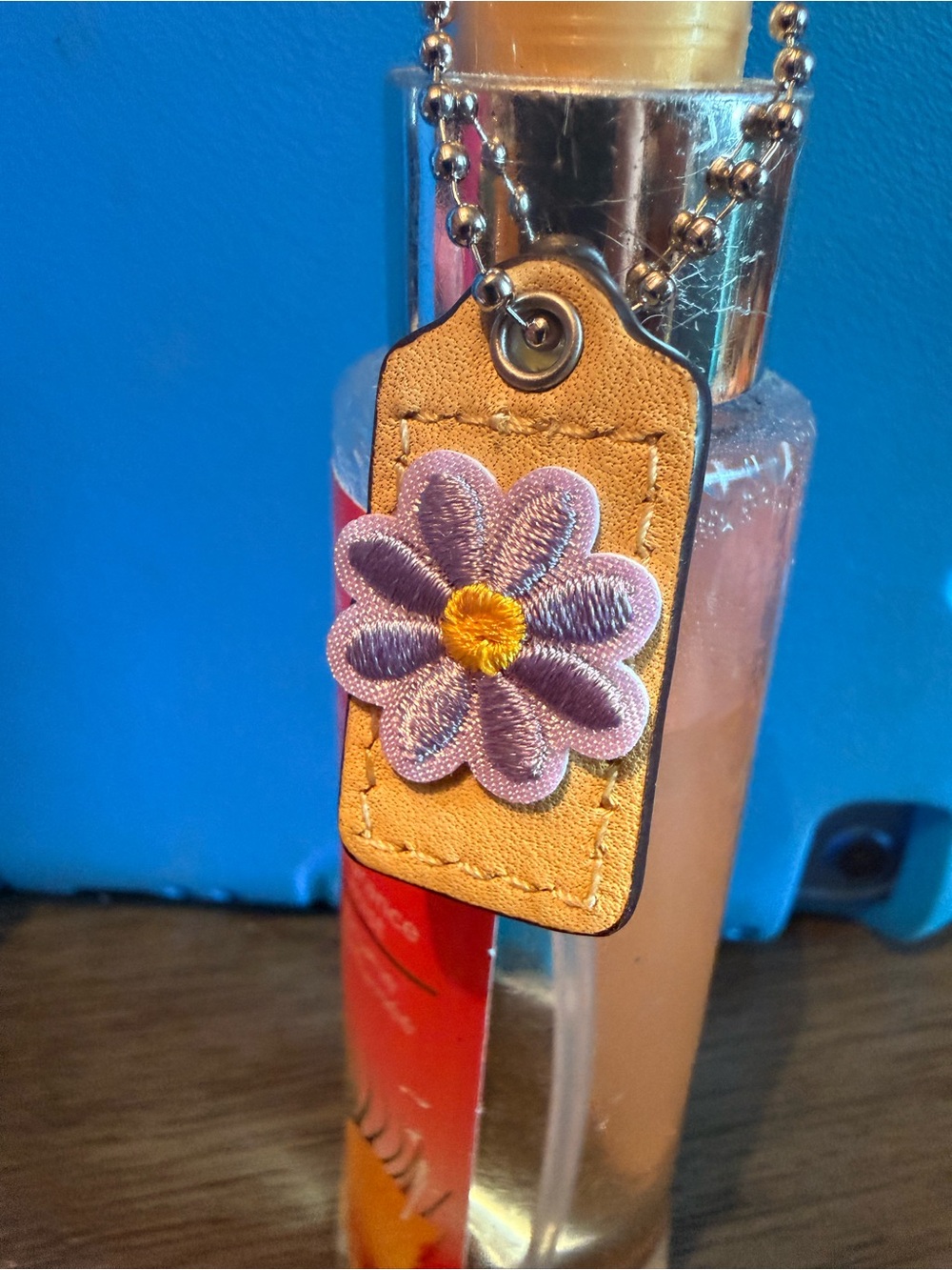 Coach Tan Shoulder Bag Charm with Lavender Flower